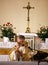 Priest, praying to God consecration the bread and wine