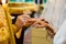 Priest puts on ring on brides finger during church wedding ceremony. Exchange of rings. Horizontal view. Marriage concept