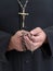 Priest with rosary