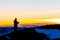 Priest silhoute reading in the sunset light, Romania