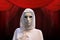 Priestess of red magic, sorcerer with magical mask occult Masonic Lodge, red background