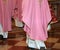 Priests with cassock in church during the Holy Mass