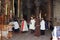 Priests at the entrance to the aedicula of the Holy Sepulchre, Jerusalem