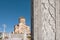 Priests and monks on relief of stone column near the Holy Trinity Cathedral in Tbilisi