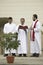 priests reading from the bible on Good Friday