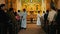 priests walking amongst the pilgrims at the end of the mass ceremony event shake hands with everyone in the local town church