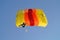 Prijedor, RS, Bosnia and Herzegovina - July 3, 2015: Skydiver, parachuter with colorful yellow, orange, red color parachute