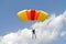 Prijedor, RS, Bosnia and Herzegovina - July 3, 2015: Skydiver, parachuter with colorful yellow, orange, red color parachute