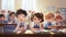 a primary elementary school group of children studying in the classroom. learning and sitting at the desk. Education theme