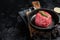 Prime Fillet Mignon Beef steak ready for cooking, Dry aged raw tenderloin meat. Black background. Top view. Space for