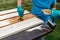 Priming boards for painting with a brush outdoors