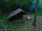 Primitive Bushcraft Adirondack lean to Shelter with campfire in the Wilderness.