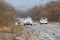 Primorsky Krai, Russia - 2016, autumn - A car drives along a bad, dead road among tall trees. Russian roads. Bad asphalt