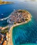 Primosten town, Croatia. View of the city from the air. Seascape with beach and old town. View from drone on the peninsula with ho