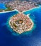 Primosten town, Croatia. View of the city from the air. Seascape with beach and old town. View from drone on the peninsula with ho