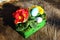 Primroses and eastereggs on a tree trunk