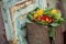 Primroses in wooden pot near a window in a alsatian t