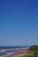 Prince Edward Island, Canada: People strolling along a red sandstone beach