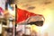 Principality of Sealand Flag Against City Blurred Background At