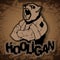 Print on T-shirt `hooligan` with a bear image on a wooden background.