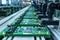 Printed circuit board assembly process. Conveyor with robotic arms in electronics factory. Semiconductor manufacturing industry