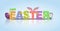 PrintHappy Easter lettering text with cute bunny ears ang colorful eggs. Isolated on blue background