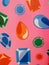 Printings of colorful diamond shaped embellishments on pink wallpaper background