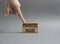 Prioritize values symbol. Concept word Prioritize values on wooden blocks. Beautiful grey background. Businessman hand. Business