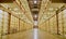 Prison cell block with cells on both sides.