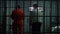 Prison employee locks male criminal in jail cell