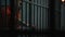 Prisoner leans on prison cell bars, talks with lawyer