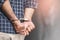 Prisoner man in jail with handcuffs. Close up Shackled in Hands