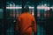 prisoner in orange prison suit in corridor. Neural network AI generated