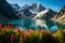 A pristine alpine lake surrounded by vibrant wildflowers and a towering, glacier-clad mountain range