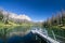 A pristine alpine lake in Wyoming with a small pier.