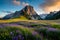 A pristine alpine meadow with a carpet of colorful wildflowers and a clear, blue sky overhead