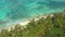 Pristine and bounty tropical shore with coconut palm trees and azure Caribbean sea. Beautiful landscape. Aerial view