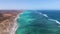 Pristine Coral Reef in turquoise water seen from above. Top down aerial footage. Ningaloo Reef, Australian tourism.