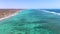 Pristine Coral Reef in turquoise water seen from above. Top down aerial footage. Ningaloo Reef, Australian tourism.