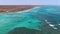 Pristine Coral Reef in turquoise water seen from above. Top down aerial footage. Ningaloo Reef, Australian tourism.