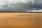 Pristine landscape with lake calm water and dramatic sky at morning