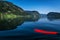 Pristine mountain lake Bohinj in Slovenia. View from kayak with red paddle