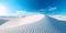 Pristine white sand dunes stretching out against a clear blue sky, evoking a sense of tranquility and solitude