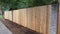 Privacy cedar fence with brick accents showing horizontal