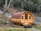 A private accommodation unit in the form of a large wooden barrel or a glamping bungalow in a barrel - the Calfeisental valley