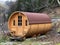 A private accommodation unit in the form of a large wooden barrel or a glamping bungalow in a barrel - the Calfeisental valley