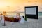 A private cinema setting on a tropical beach