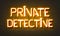 Private detective neon sign on brick wall background.