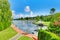 Private dock with deck chairs and boat.