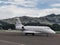 Private Jet Gulfstream Parking in a Airport Rounded By Mountains